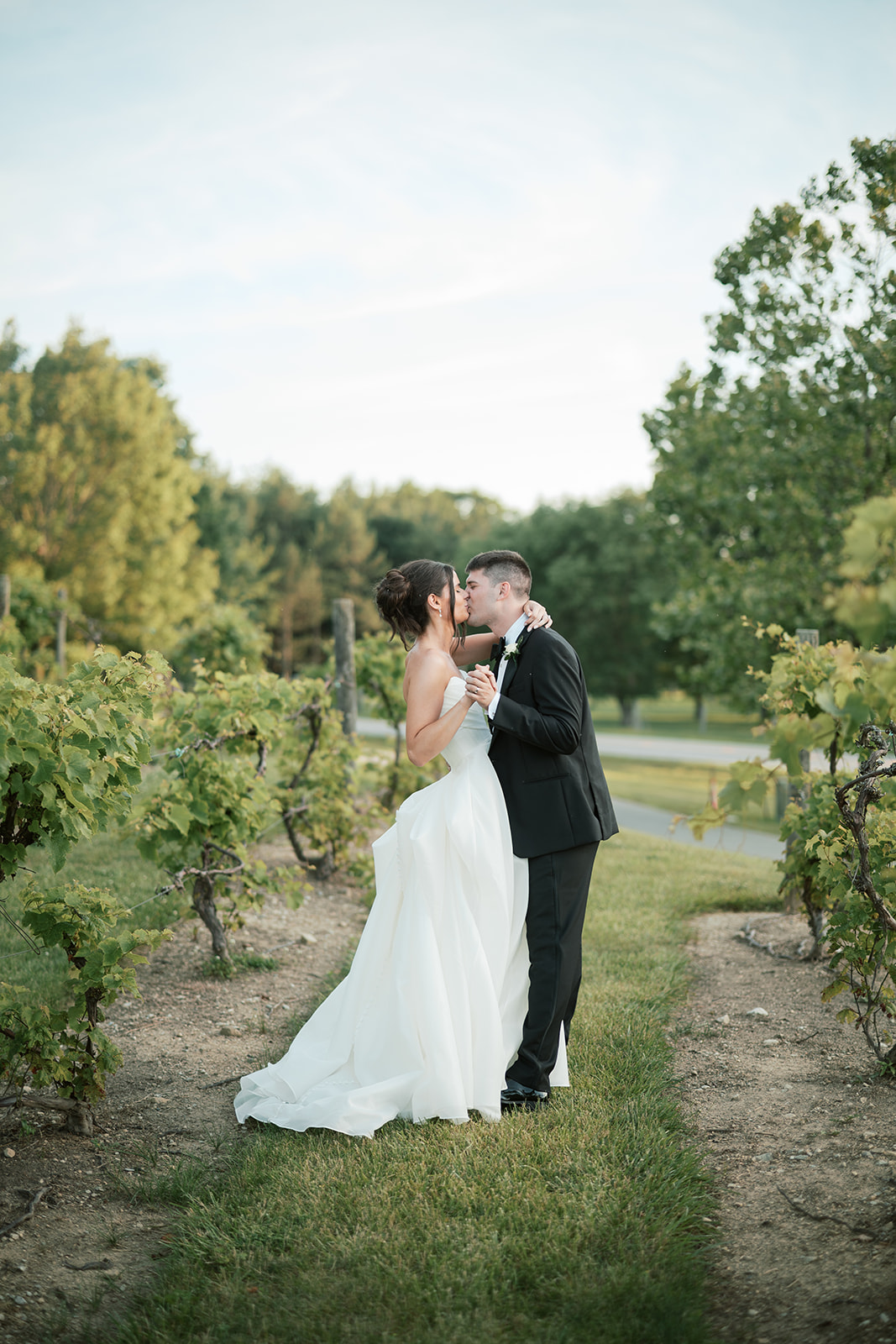 bride and groom dancing in vineyard